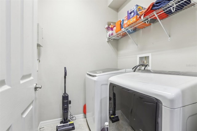 washroom with washing machine and dryer