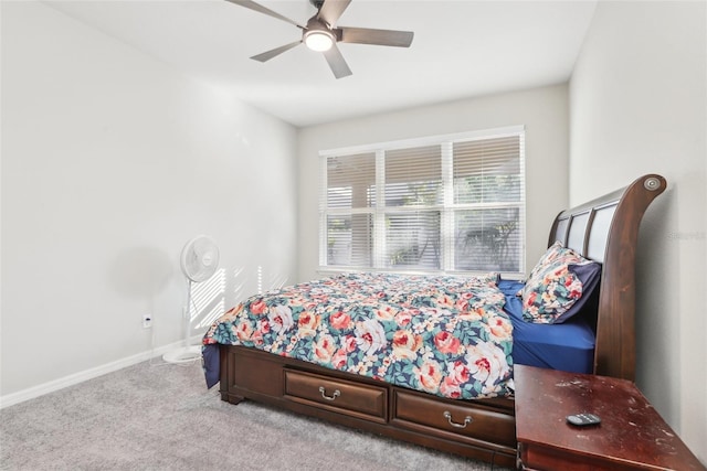 bedroom with ceiling fan and light colored carpet