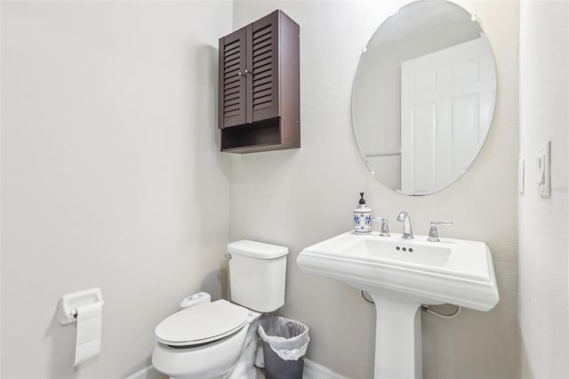 bathroom with sink and toilet