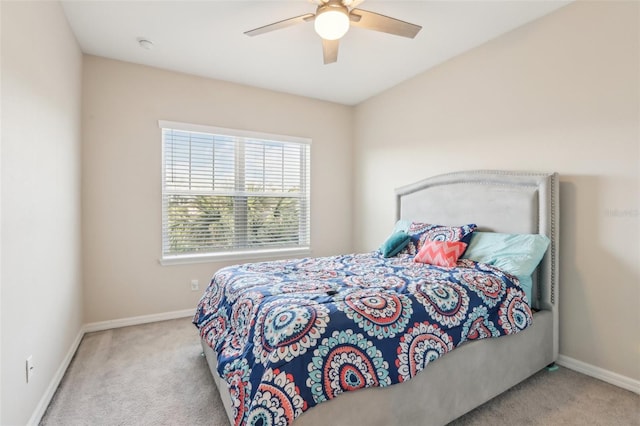 bedroom with light carpet and ceiling fan