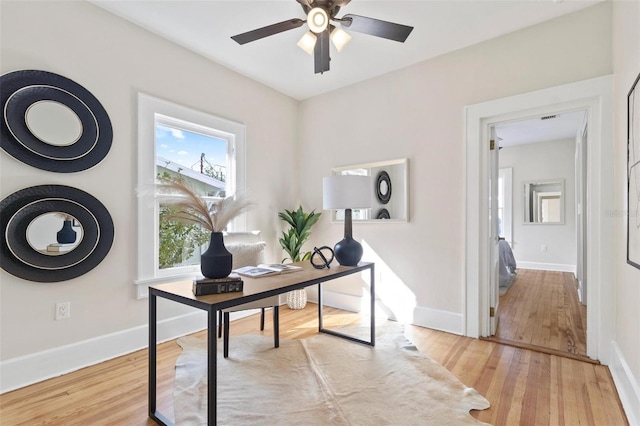 office featuring ceiling fan and light hardwood / wood-style floors