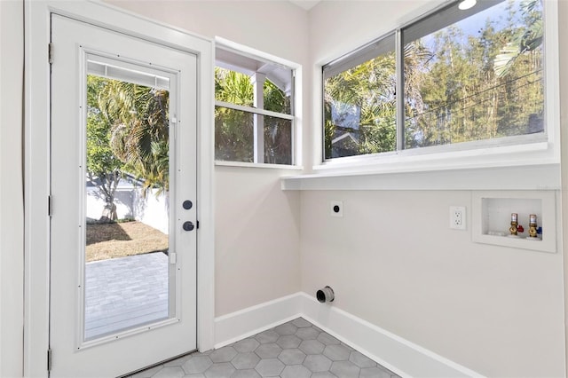 laundry area featuring tile patterned flooring, hookup for a washing machine, and electric dryer hookup