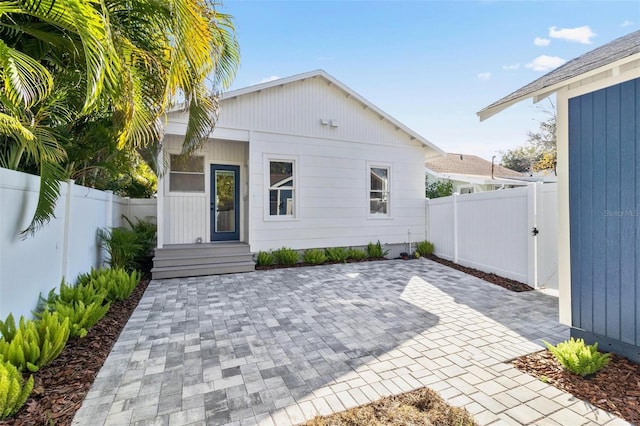 rear view of property featuring a patio