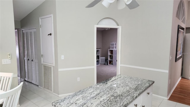 corridor featuring light tile patterned floors