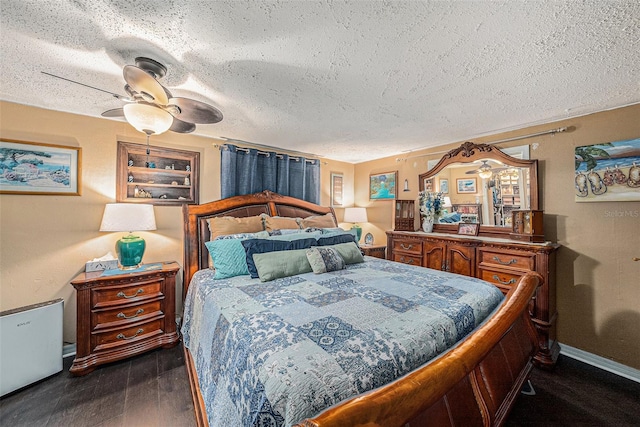 bedroom featuring ceiling fan, dark wood-type flooring, and a textured ceiling