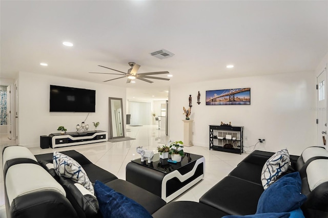 living room featuring ceiling fan and light tile patterned floors