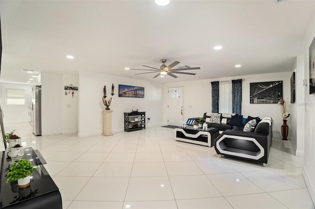 tiled living room featuring ceiling fan