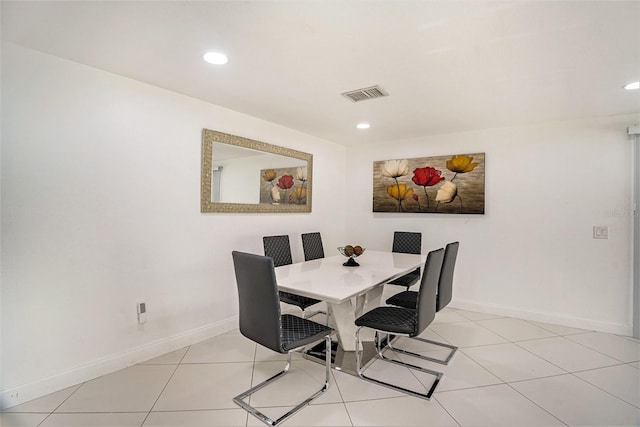 dining area with light tile patterned floors