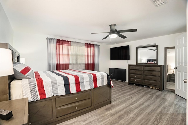 bedroom featuring light hardwood / wood-style flooring and ceiling fan