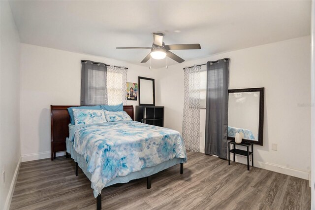 bedroom featuring hardwood / wood-style flooring and ceiling fan