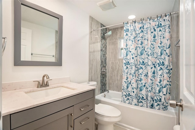 full bathroom with vanity, toilet, and shower / bath combo with shower curtain