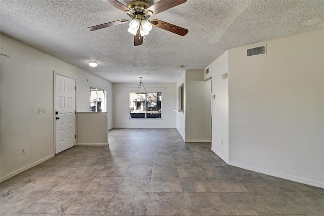 unfurnished room with a textured ceiling and ceiling fan