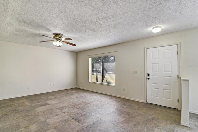 entrance foyer with ceiling fan