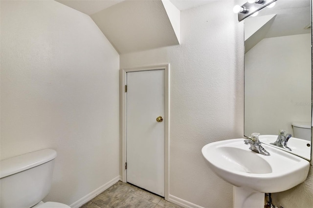 bathroom featuring sink and toilet