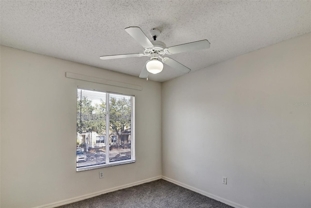 unfurnished room with ceiling fan, carpet floors, and a textured ceiling