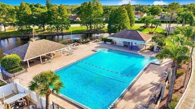 view of swimming pool featuring a gazebo, a water view, and a patio