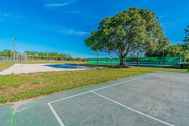 exterior space with a yard and volleyball court