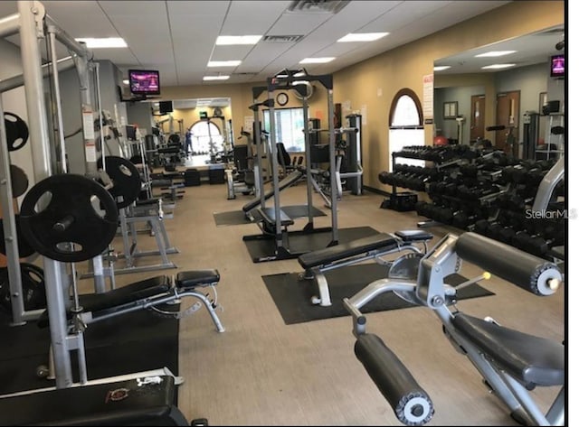 exercise room featuring a drop ceiling