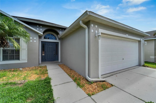 property entrance with a garage