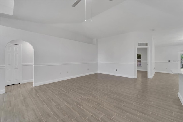 unfurnished room with lofted ceiling and ceiling fan