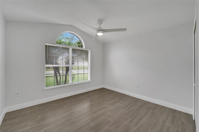 empty room featuring ceiling fan and lofted ceiling