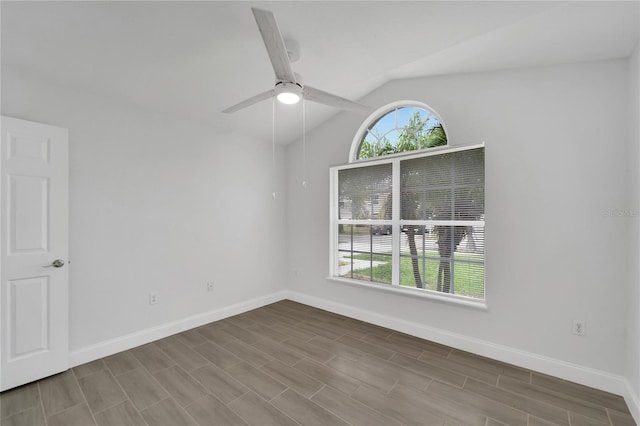 spare room with vaulted ceiling and ceiling fan