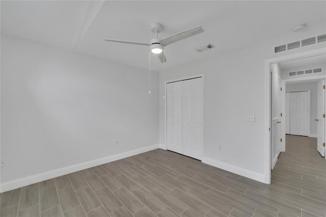 unfurnished bedroom featuring a closet and ceiling fan