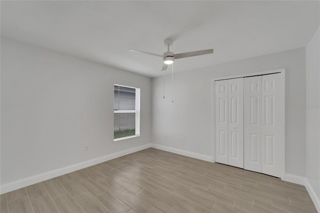 unfurnished bedroom featuring a closet and ceiling fan