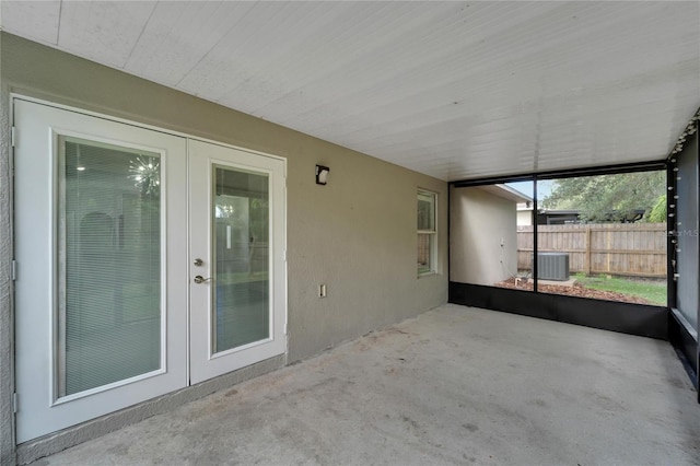 unfurnished sunroom with french doors