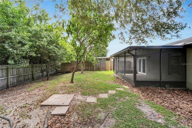 view of yard with a sunroom