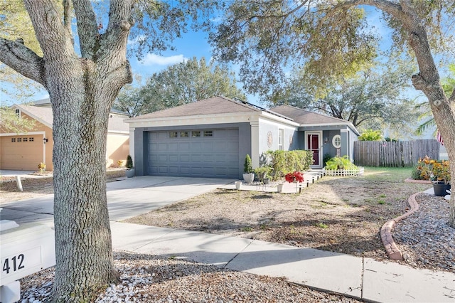 ranch-style home with a garage