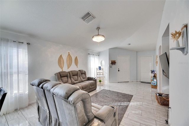 living room with lofted ceiling