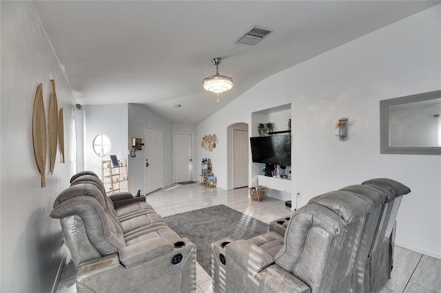 living room featuring vaulted ceiling