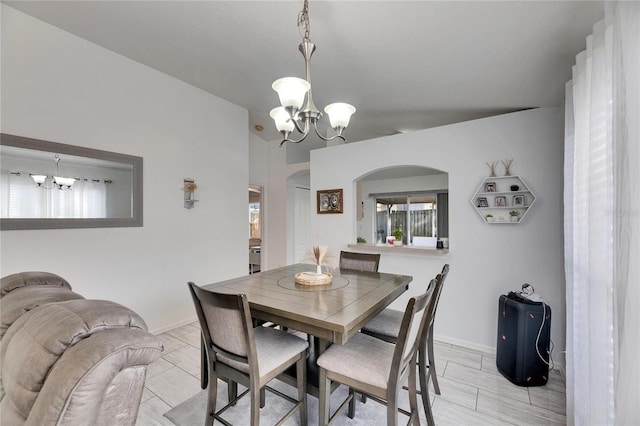 dining space with a chandelier