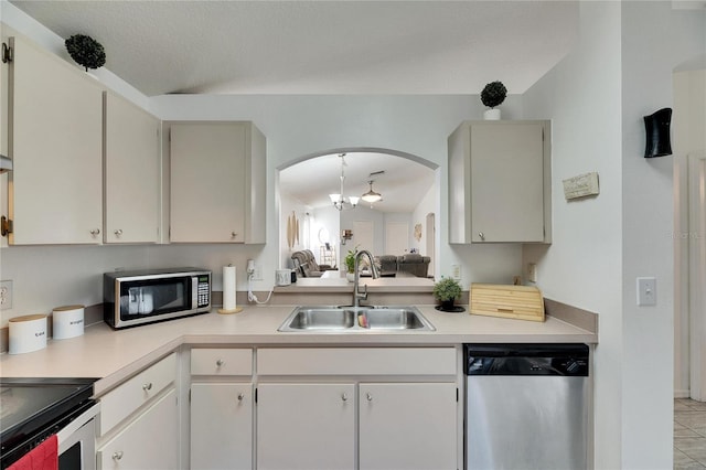 kitchen featuring white cabinetry, appliances with stainless steel finishes, sink, and light tile patterned floors