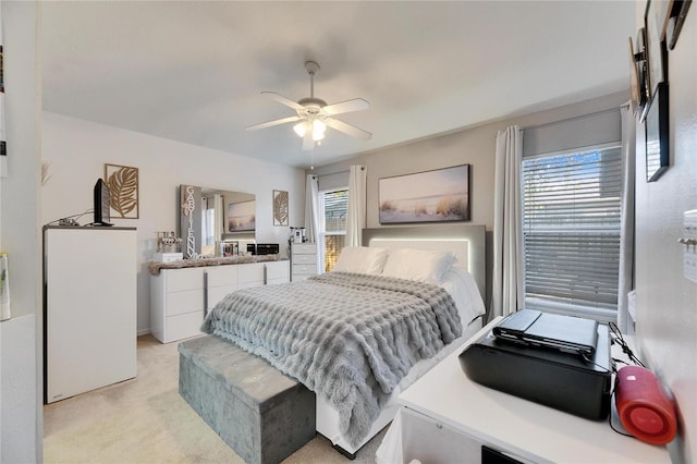 carpeted bedroom with ceiling fan