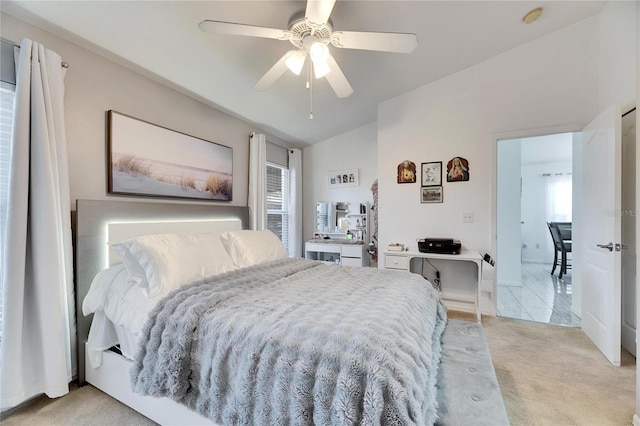 carpeted bedroom with lofted ceiling and ceiling fan