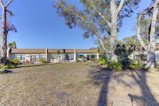 exterior space with a front lawn