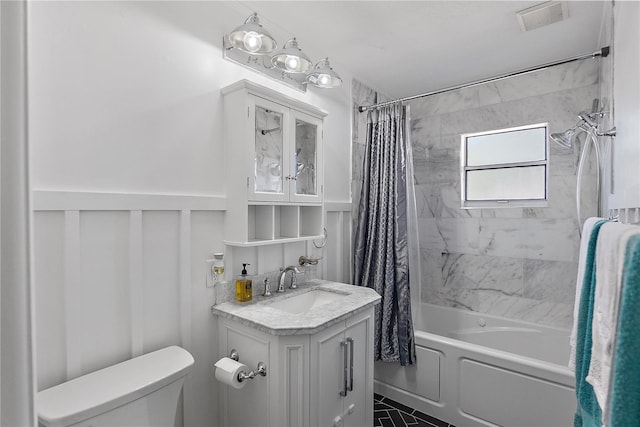 full bathroom featuring shower / bath combination with curtain, vanity, toilet, and tile patterned flooring