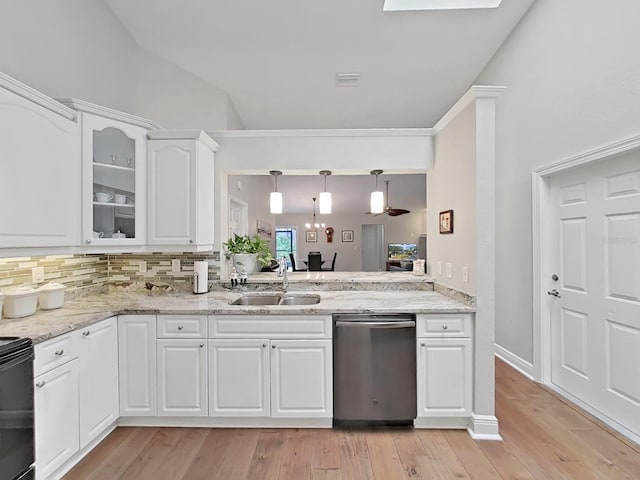 kitchen featuring sink, dishwasher, decorative backsplash, white cabinets, and decorative light fixtures