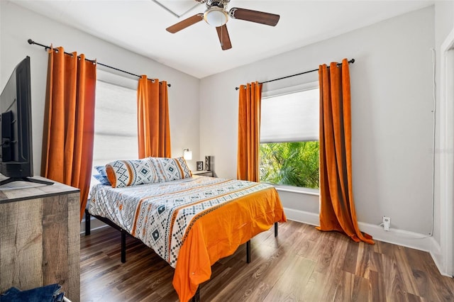 bedroom with wood-type flooring and ceiling fan