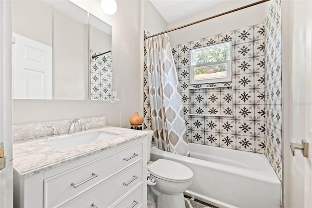 full bathroom with vanity, shower / bath combo with shower curtain, and toilet