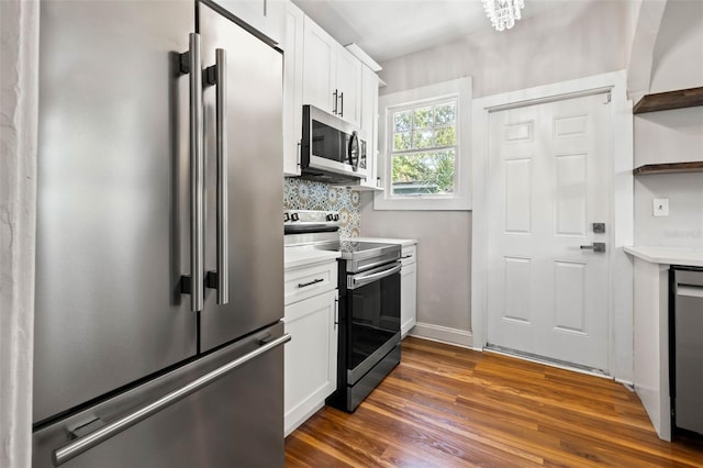 kitchen featuring white cabinetry, decorative backsplash, dark wood-type flooring, and stainless steel appliances