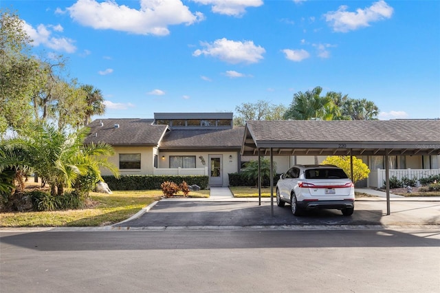 view of front facade with a carport