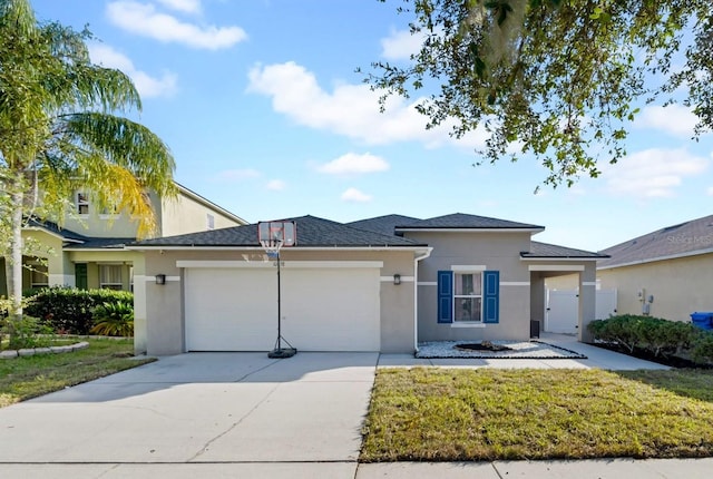 view of front facade with a garage and a front yard