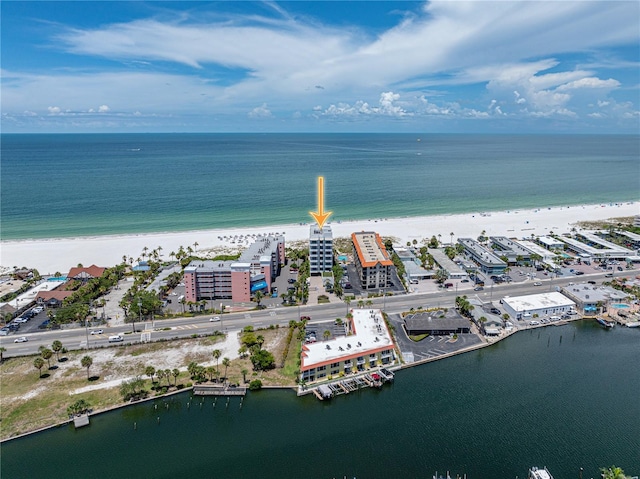 drone / aerial view with a water view and a beach view