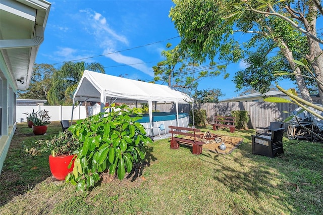 view of yard featuring a gazebo and a fenced in pool