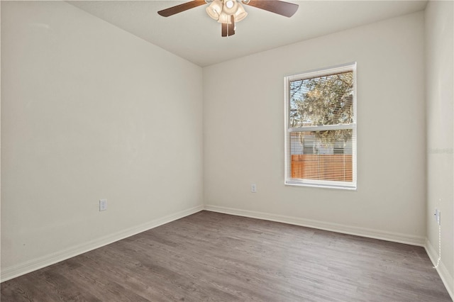 empty room with hardwood / wood-style floors and ceiling fan