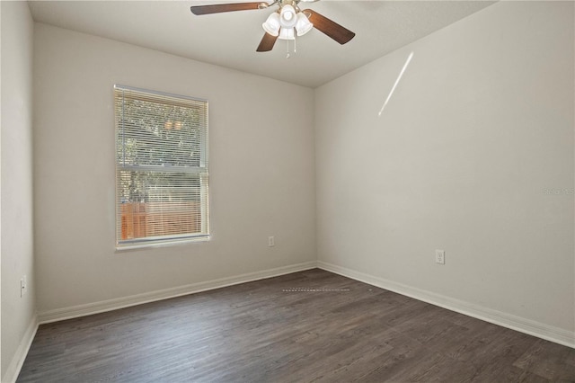 empty room with dark wood-type flooring and ceiling fan