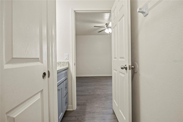 corridor featuring dark hardwood / wood-style flooring